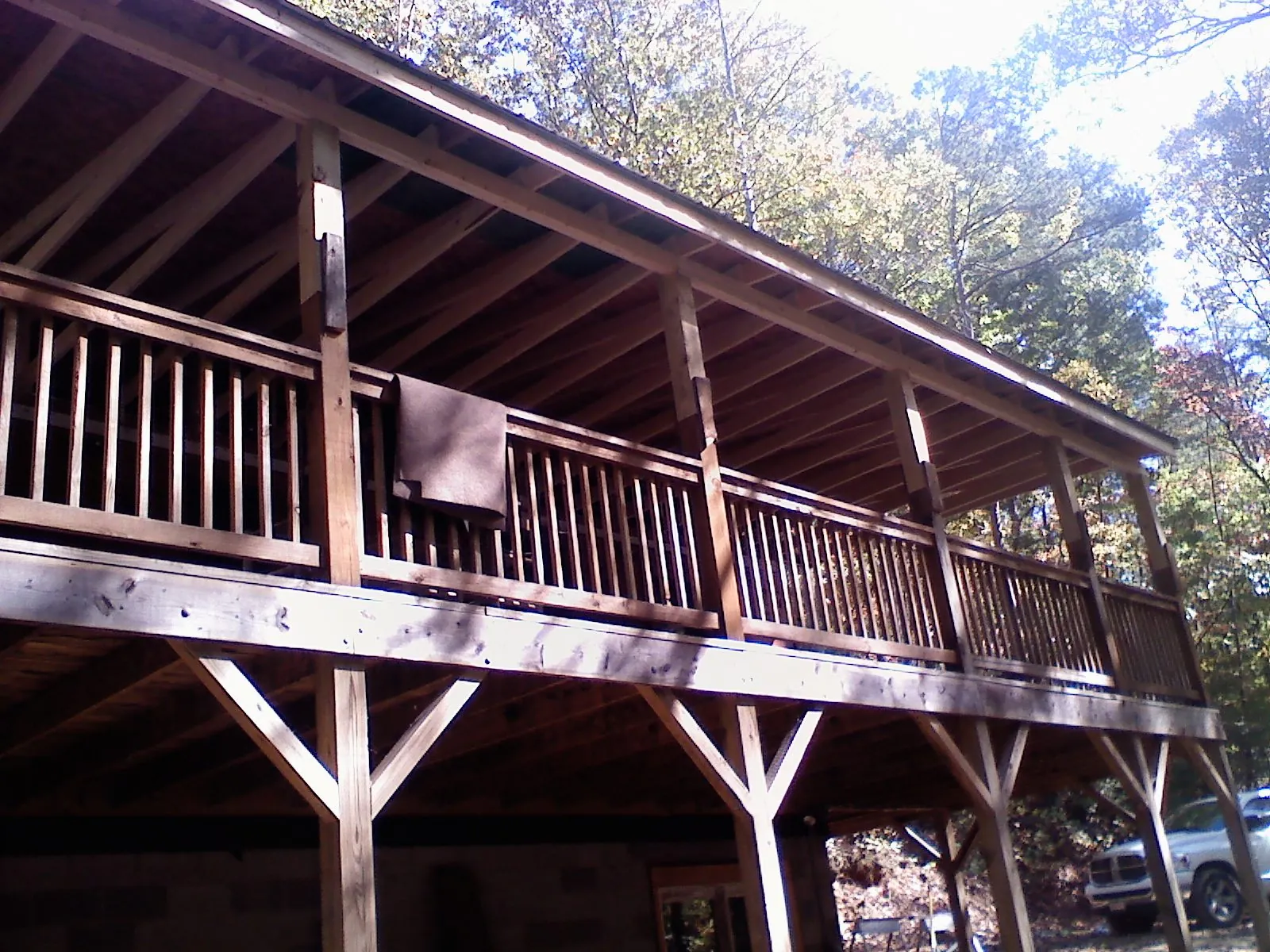 Timber framing under a new elevated porch and deck — Roof Leak Repair in Inverness by Roofing Brothers